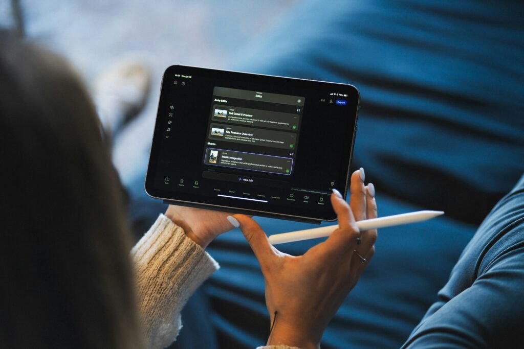 Person using a tablet and stylus to edit an AI-generated resume, representing the process of refining a professional, ATS-friendly resume before applying for jobs.