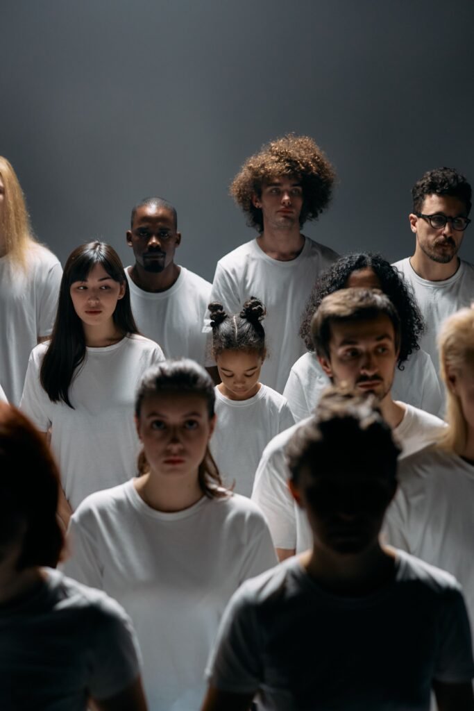 A diverse group of creative professionals collaborating together, representing the wide range of people who can benefit from using Midjourney for AI image generation.
