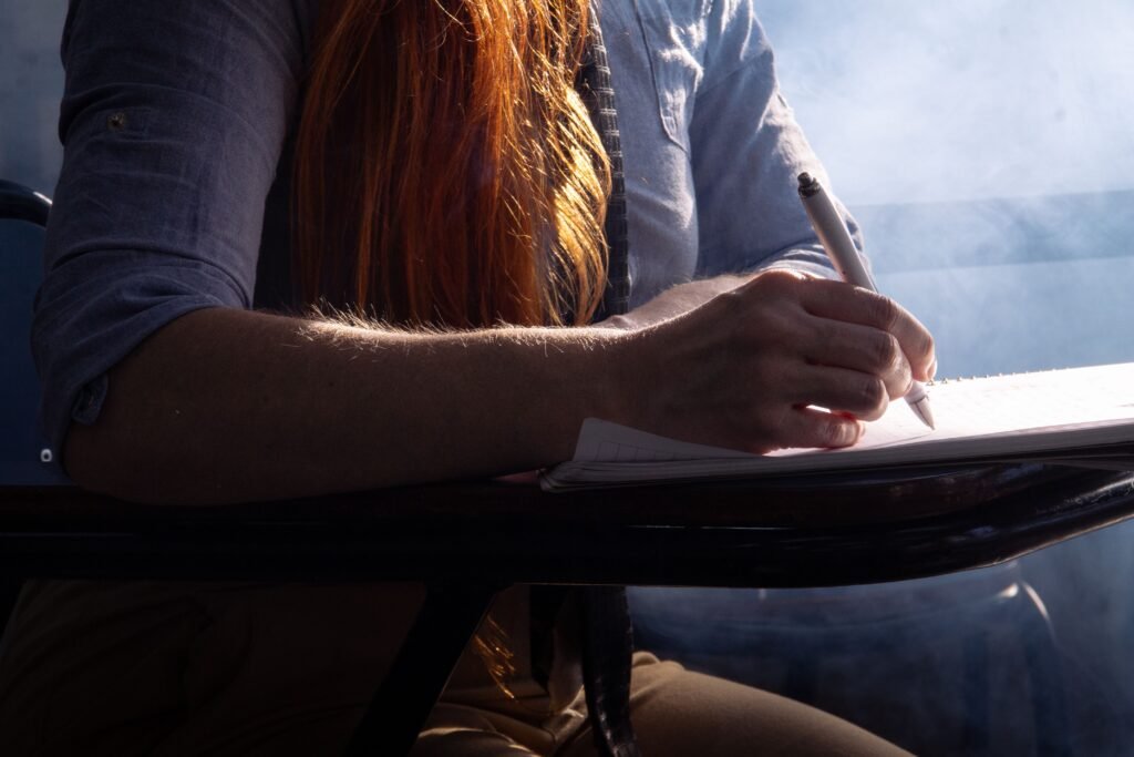 Student using artificial intelligence tools to study, write notes, and improve learning in a modern classroom.
