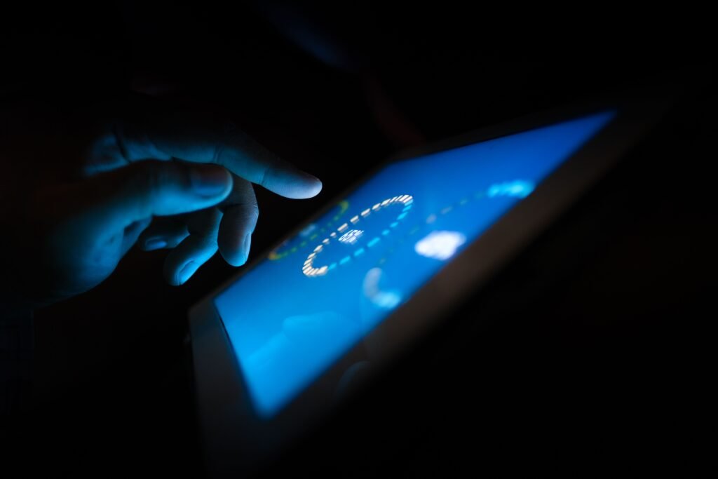 A person using a touchscreen device to interact with digital tools, representing the intuitive user experience of creating AI-generated images with Midjourney.