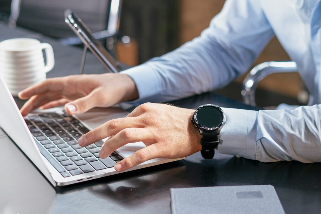 Freelancer using AI tools on a laptop to improve productivity